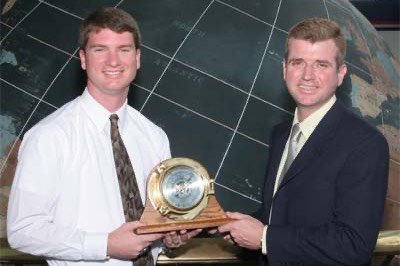 Mark Agnew (r), Operations Supervisor of the Exxon Mobil refinery in south Mobile County, presents the 2005 ExxonMobil Academic Award to Chris Dyke(l).