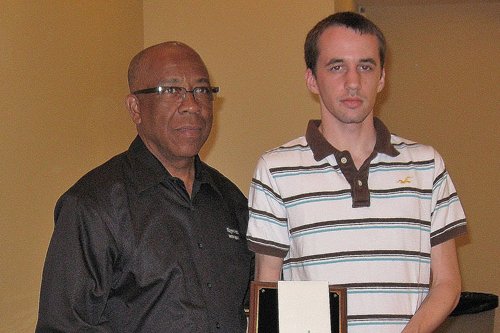 Sean Jones receives the 2012 ExxonMobil Scholarship Award from Richard Benjamin of ExxonMobil.
