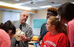 Dr. Phil Carr showing skull in class