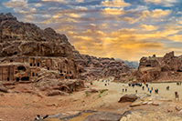 Desert scene with people viewing and hiking.