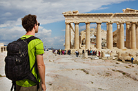 Student in Greece sightseeing with backpack on.
