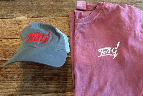 Image of front of TAG shirt and hat.