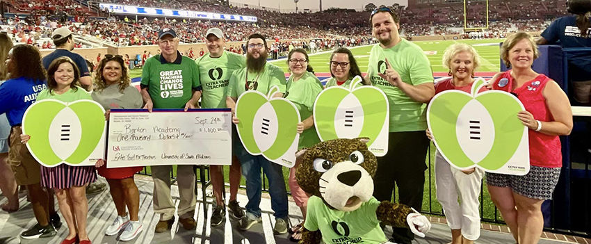 Winners of the contest at the football game with Southpaw.