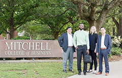 Mitchell Scholars smiling outside in front of sign