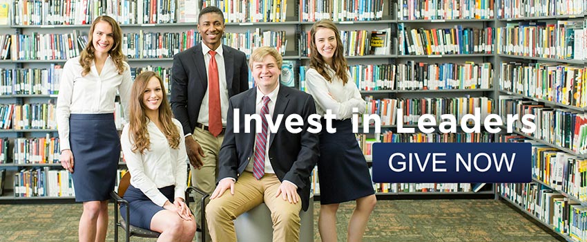 Invest in Leaders Image with students in front of library books