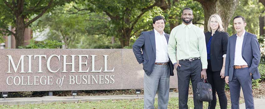 The Mitchell Scholars standing in front of Mitchell College of Business