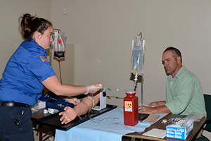 Student practicing giving an iv.