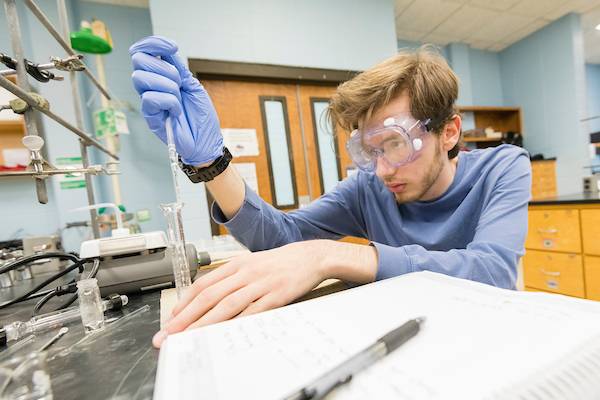 Male student working in lab.