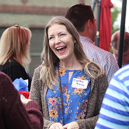 Alumni member laughing at an event.