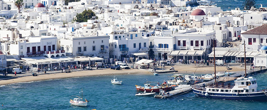 Greece showing boats and white buildings.