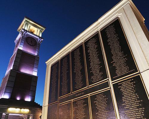 Night shot of Moulton Tower and Wall of Honor