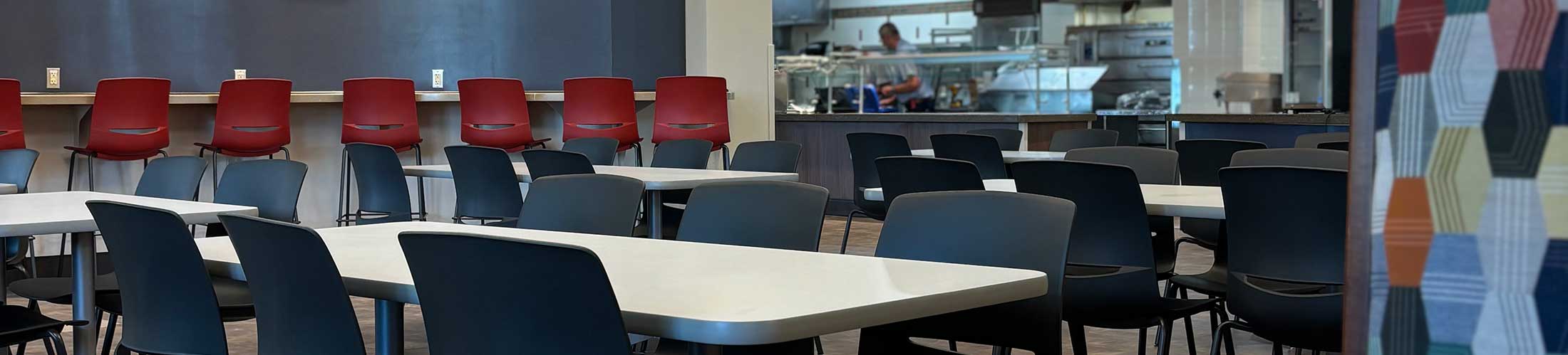 Tables and chairs with a geographic wall.