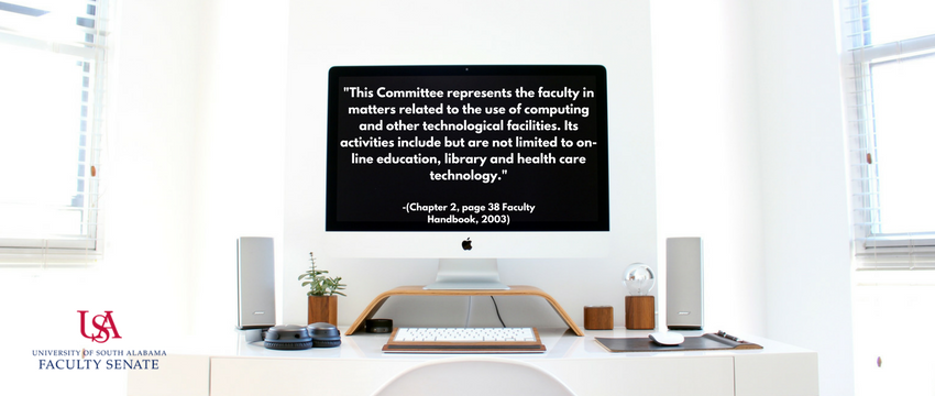 Computer at desk with the text Technology committee.
