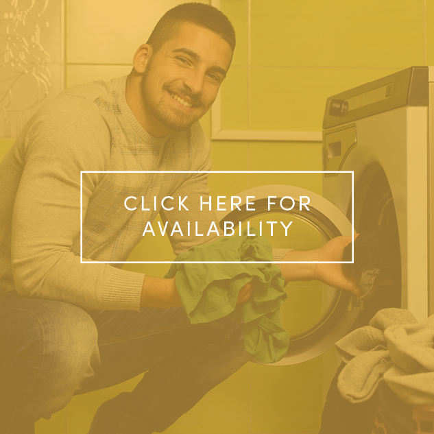 Man pulling clothes out of dryer