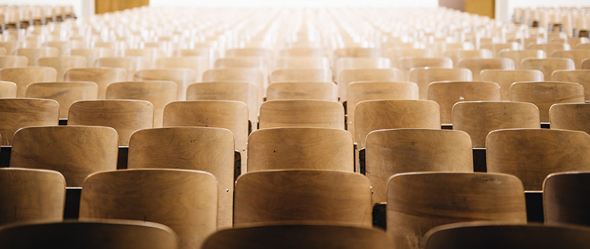 photo of empty chairs in an auditorium