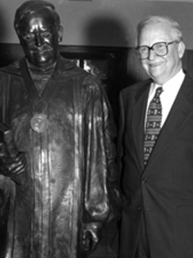President Whiddon with statue made in his honor.