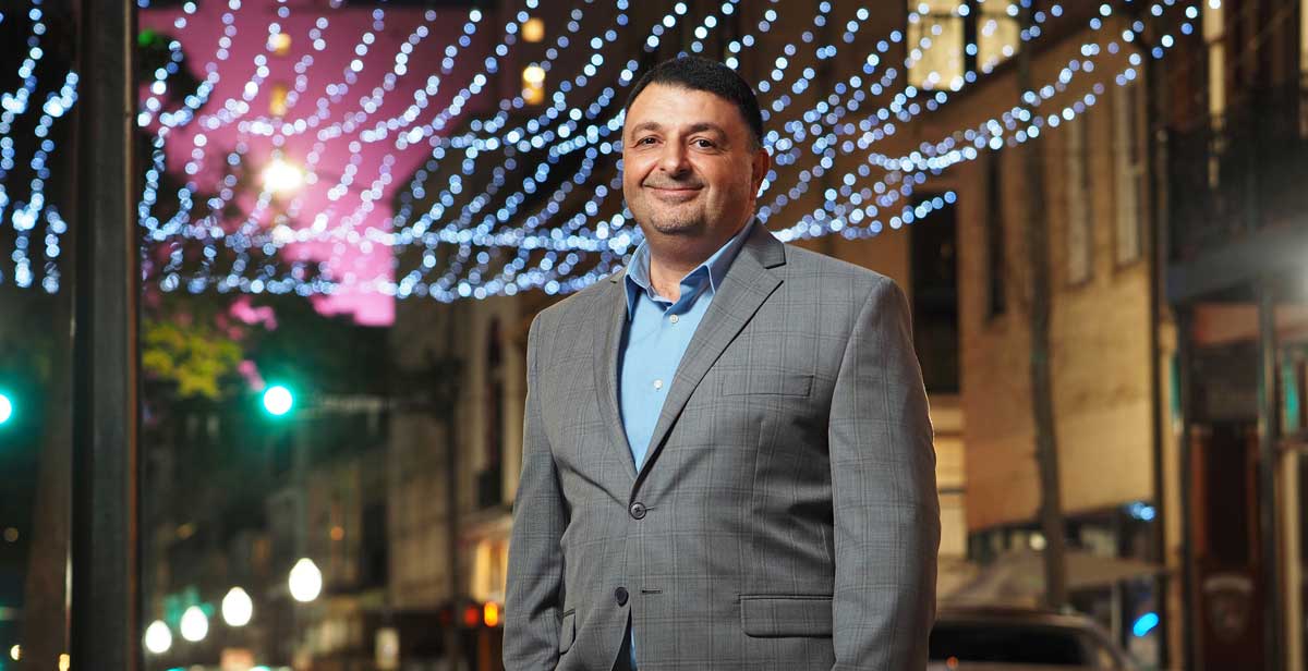 Dr. Khaldoon Nusair, the new department chair for Hospitality and Tourism Management at the University of South Alabama, said the future of South's program includes specializations in the major. Here, Nusair stands in the middle of downtown Mobile's entertainment district – a popular draw for both locals and tourists with restaurants, music and event venues, and lodging. data-lightbox='featured'
