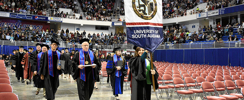 Faculty during Graduation Processional in Mitchell Center.