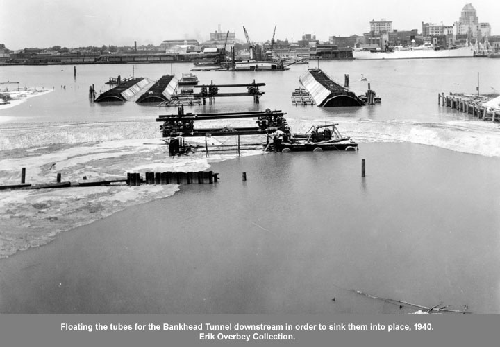 Floating the tubes for the Bankhead Tunnel downstream in order to sink them into place, 1940. 