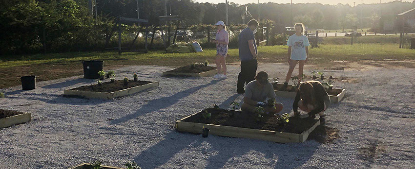 Students working in the Community Garden at South.